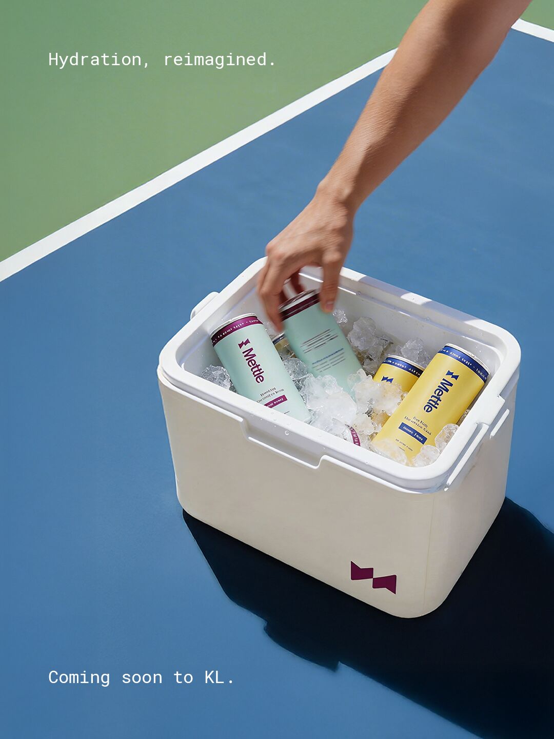 Mettle cooler on a blue court with the line Hydration, reimagined